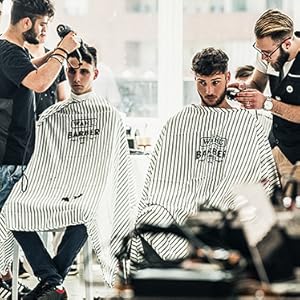 Cadre de salon professionnel montrant les services de coiffure en cours d'exécution, avec une palette de couleurs bordeaux et blanc en arrière-plan.