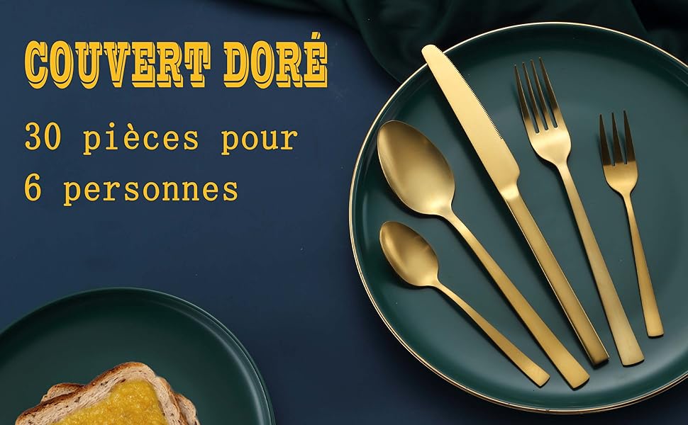 une assiette avec des couverts en or et une assiette avec une fourchette et une cuillère.