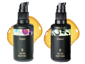 Deux bouteilles en verre foncé avec distributeur à pompe, étiquetées « Argan » et « Castor ». Les fonds circulaires jaunes évoquent des produits pétroliers.