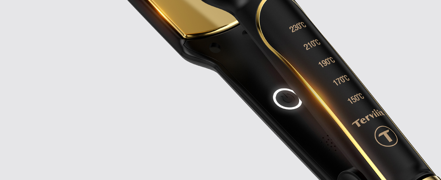 Gros plan du manche d'un outil de coiffure. Noir avec des accents dorés, avec des commandes de température allant de 150 °C à 230