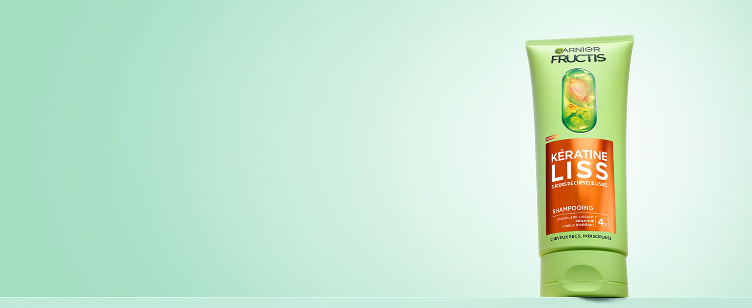 Le texte indique « Garnier Fructis ». L'emballage du produit est présenté dans une palette de couleurs vert menthe avec le logo de la marque visible.