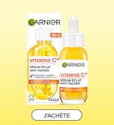 Le texte se lit comme suit : « GARNIER » et « J'ACHÈTE ». Image du produit montrant un flacon de sérum de vitamine C contenant un liquide jaune-orange et une boîte de produit assortie portant la marque de vitamine C.