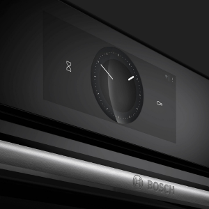 Interface du panneau de commande noir représentant ce qui semble être un appareil, avec un simple cadran ou bouton circulaire sur fond sombre.