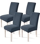 Fauteuils d'appoint rembourrés sans accoudoirs bleu marine présentés sous plusieurs angles. Dispose d'un tissu texturé à motif quadrillé et d'un design moderne.