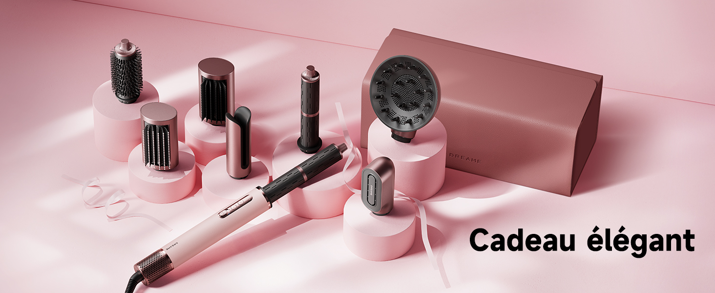 Le texte indique « Cadeau élégant ». Collection d'outils et d'accessoires de coiffure disposés sur fond rose, y compris des pinceaux et des accessoires de coiffage.
