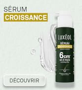 Le texte indique « SERUM CROISSANCE » et « DÉCOUVRIR ». Flacon vert foncé de sérum de croissance Luxeol avec indicateur de mesure « 6 cm » sur fond clair avec des gouttelettes d'eau.